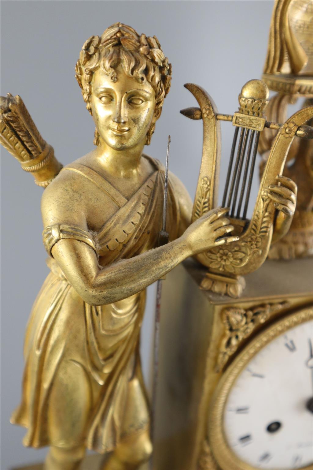 A 19th Century French Empire style ormolu mantel clock, height 15in.